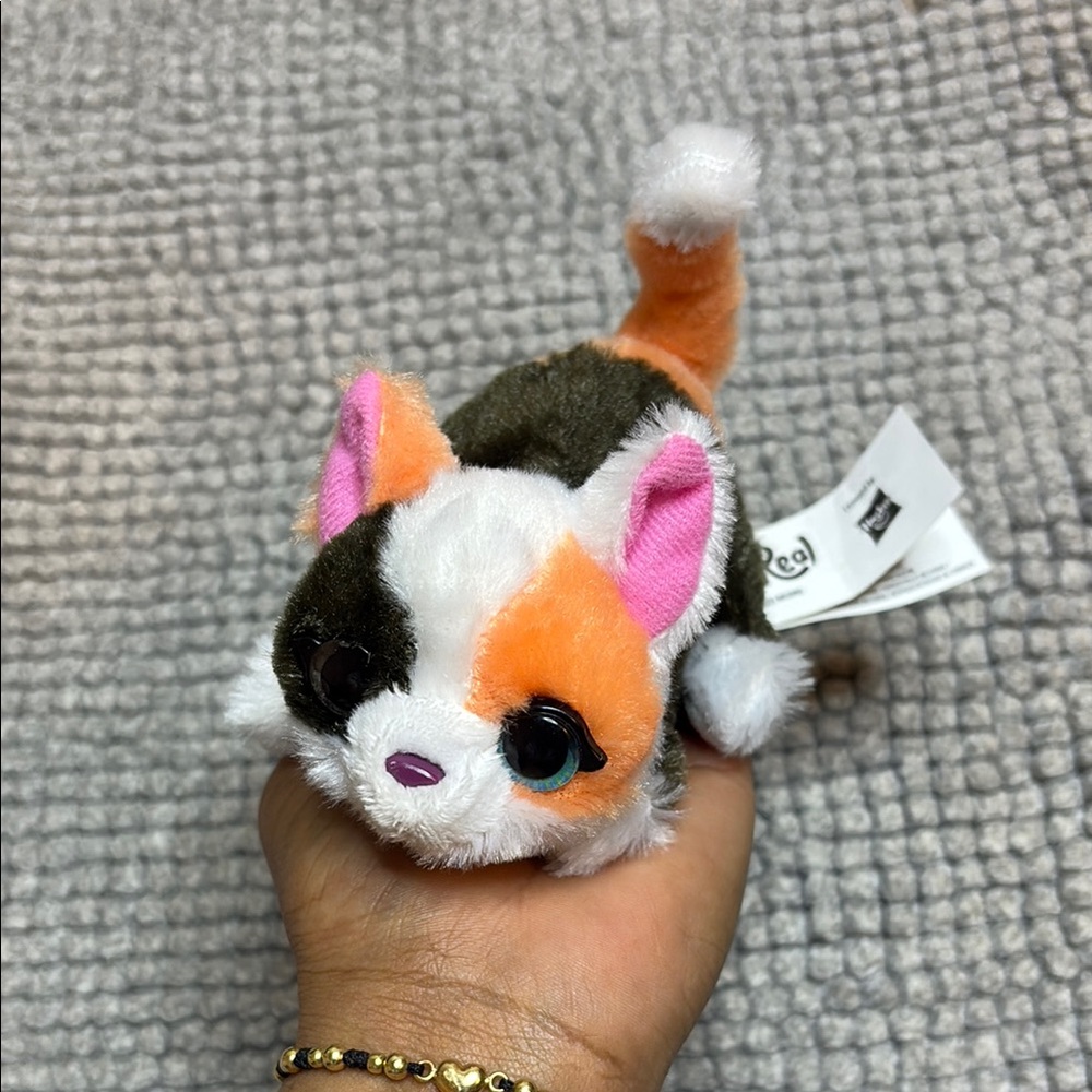 Whimsical Orange and White Plush Toy with Pointed Ears